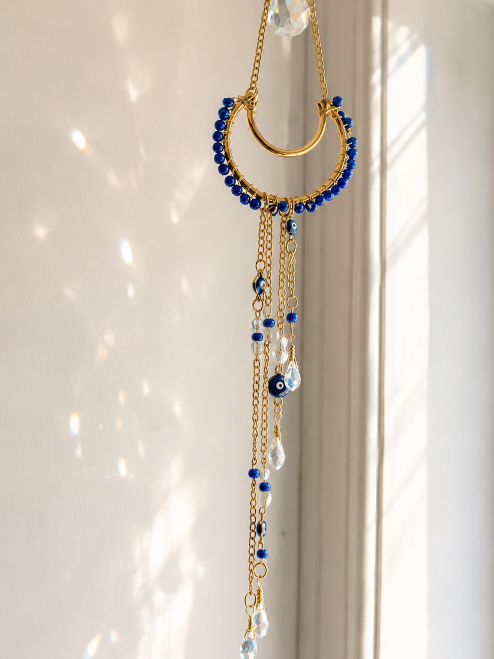 Gold moon suncatcher with Blue Beads and Crystal Drops evil eye